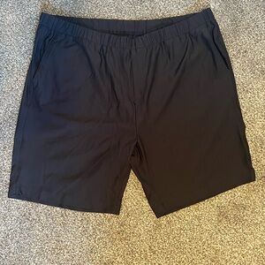 Black Greg Norman golf shorts